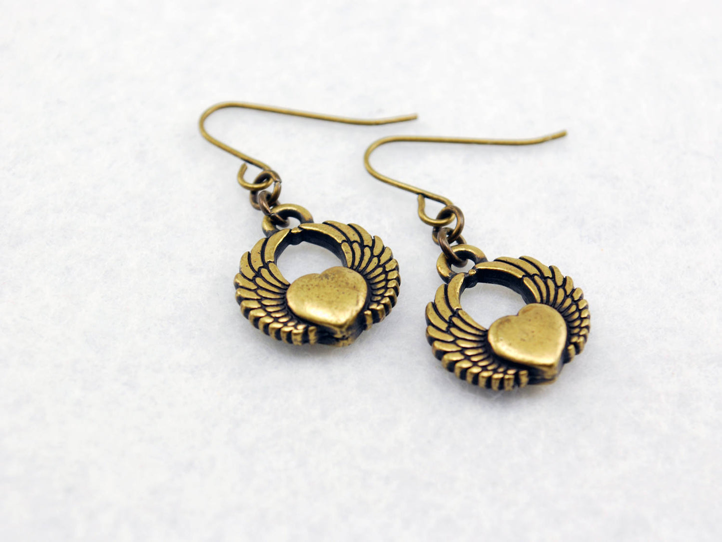 Winged Heart Earrings in Antique Brass